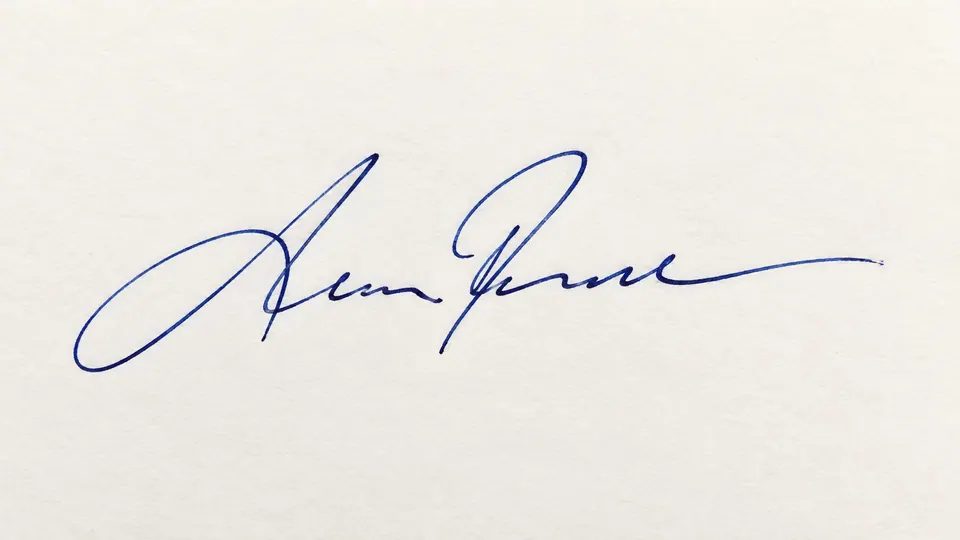 Handwritten signature on light paper
